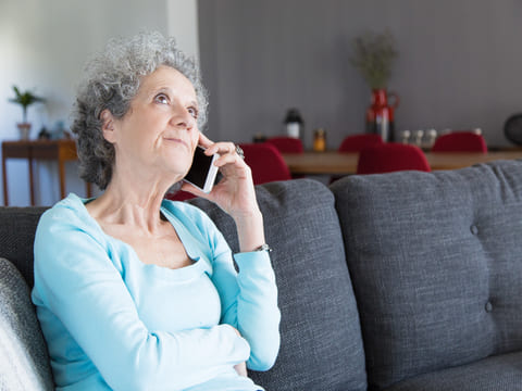 Senior checking paperwork for signs of elder fraud Medicare scams